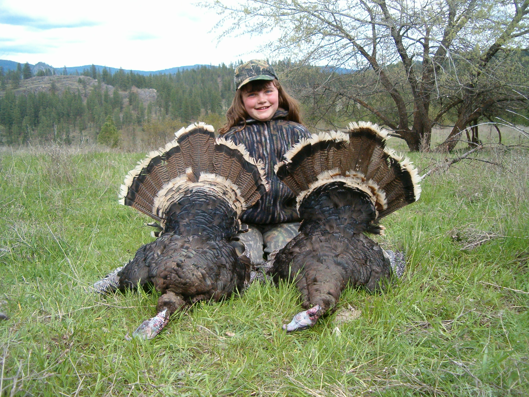 Girl hunter with her first two turkeys