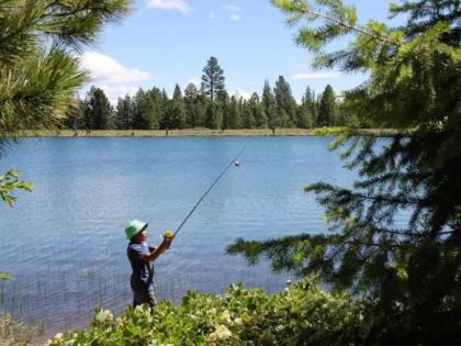 Youth fishing at a lake