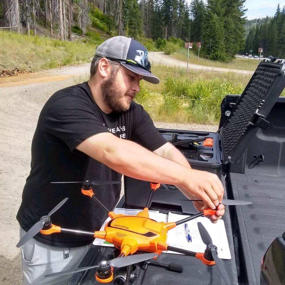 Daniel Auerbach prepares a drone for flight