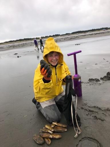Sue Cadden displays a nice batch of razor clams she dug at Copalis Beach