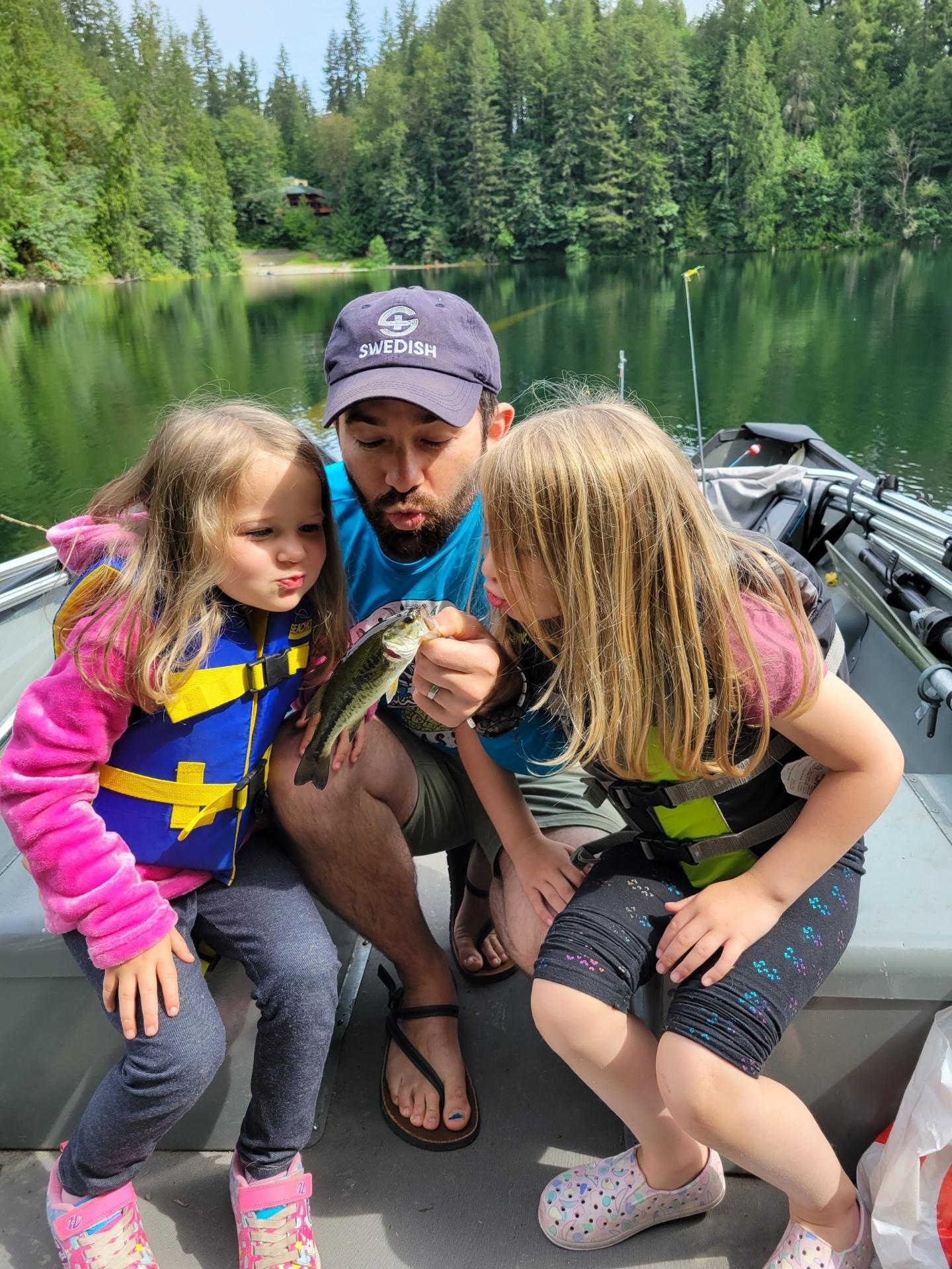 Dad fishing on Langlois Lake with his two daughters