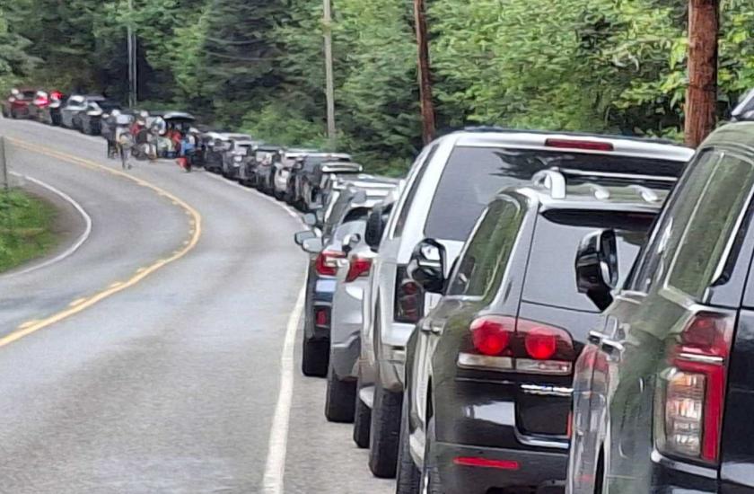 Cars parked along roadway near Shine Tidelands and Wolfe Property shellfish beaches on April 27, 2025.