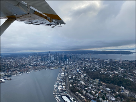 Seattle flyby and Biologists Murphie, Hamer, and Evenson in the fuselage (Photo1)