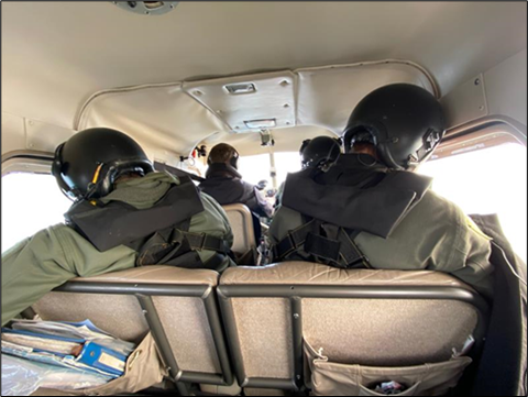 Seattle flyby and Biologists Murphie, Hamer, and Evenson in the fuselage (Photo 2)