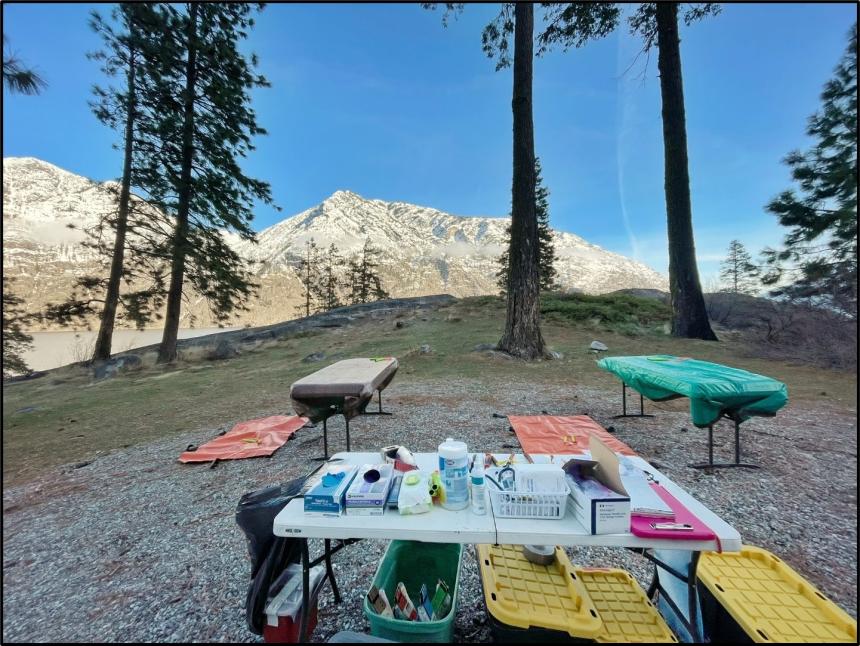 Tables set up with equipment for processing mountain goats