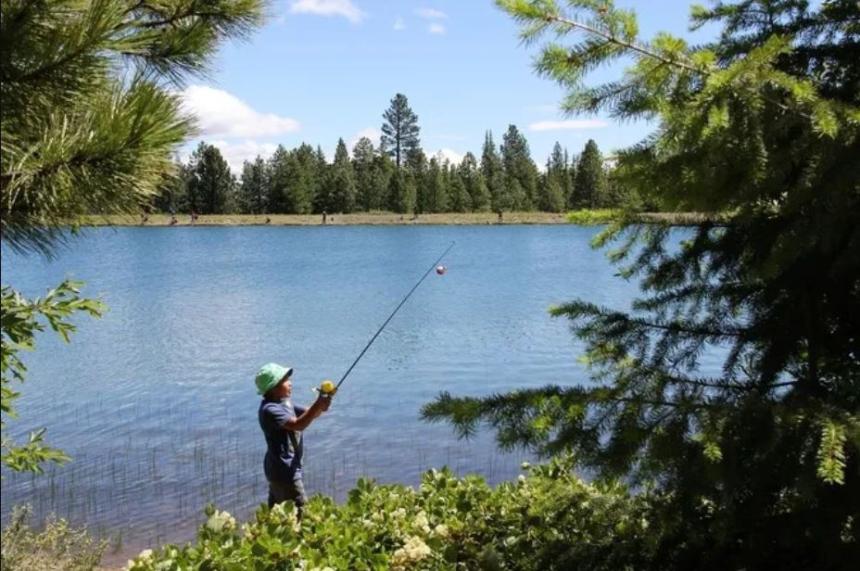 Youth fishing at a lake