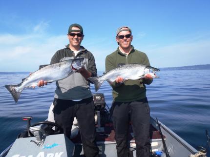 Anglers with coho salmon in Puget Sound