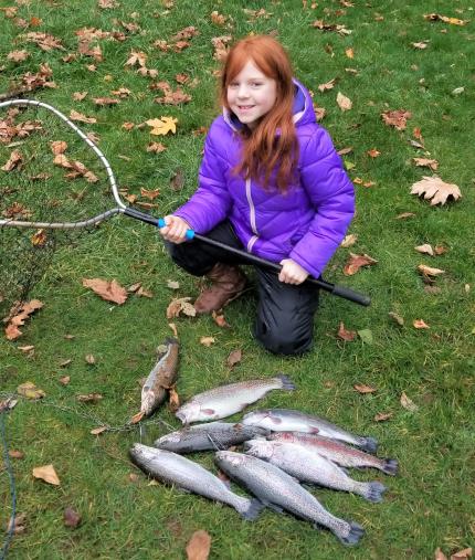 Girl with a nice pile of trout