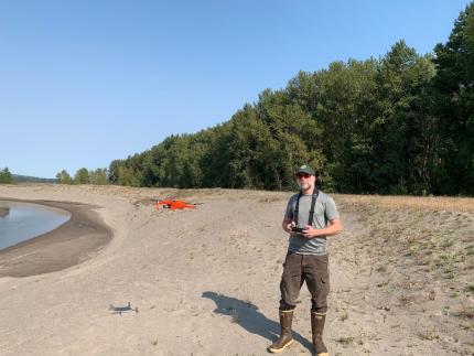 Biologist flies a drone to collect habitat data