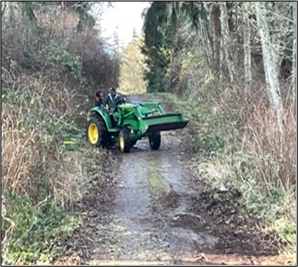 A tractor clearing a road