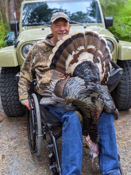 Man in wheelchair turkey hunting