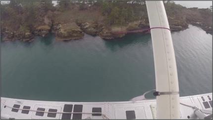 An aerial view from a plane towards the shore