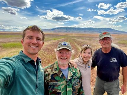 WDFW and USFWS staff in front of a field