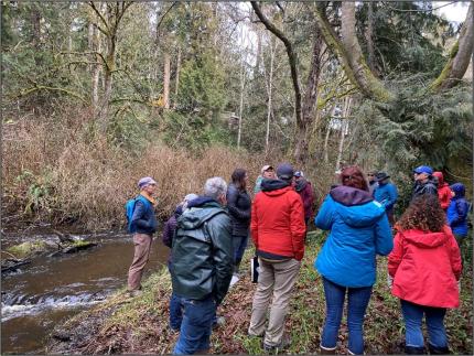A group of people visiting Chimacum Creek.
