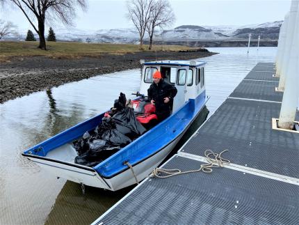 A boat with bags of grass seed