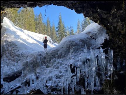 Looking out from an icy cave entrance
