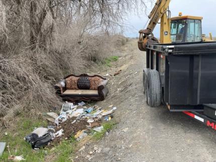 An abandoned coach and trash.