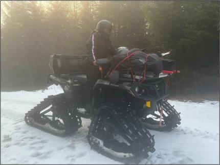 District Biologist Tirhi driving the tracked ATV to reach sooty grouse survey routes.