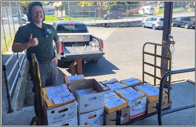 Conflict Technician Kolenberg with the 3,400 mailers at the White Salmon Post Office