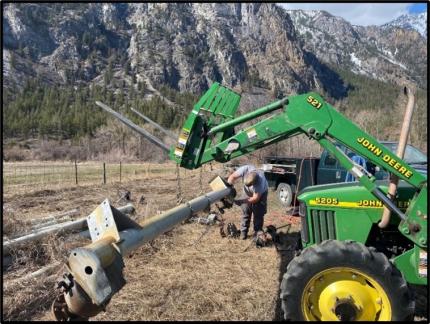 Staff member Rise removing a gear box from the pivot frame.