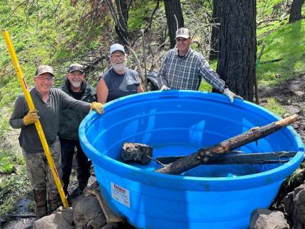 A water trough being installed by Rocky Mountain Elk Foundation volunteers.
