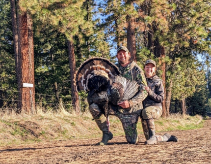 A successful hunter with his turkey.