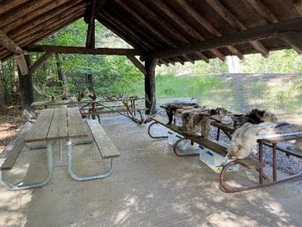 Covered area with benches and pelts
