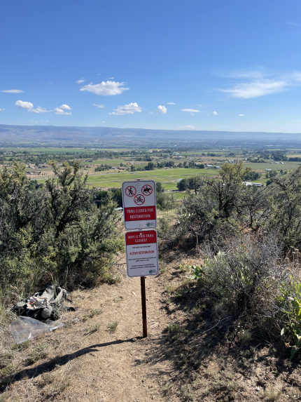 A sign blocking trail traffick