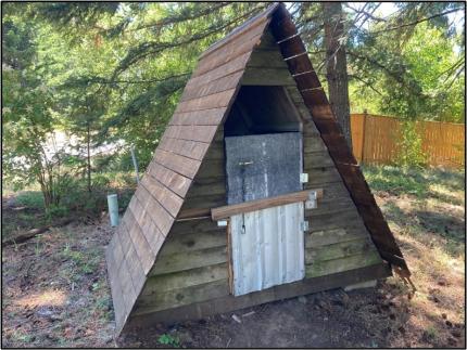 Unsecured garbage-storage shed.