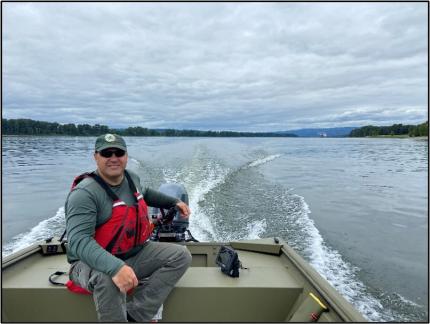 Wildlife Area Manager Hauswald takes the helm of the new Mt. St. Helens boat.