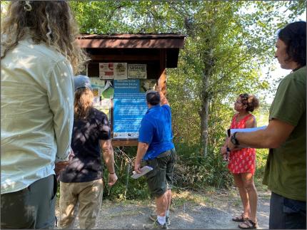 Several people traveling the Union River Wildlife Area Unit trail