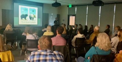 A classroom of local hikers learning about bear safety