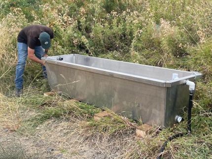 Lopez installing a new aluminum water tank