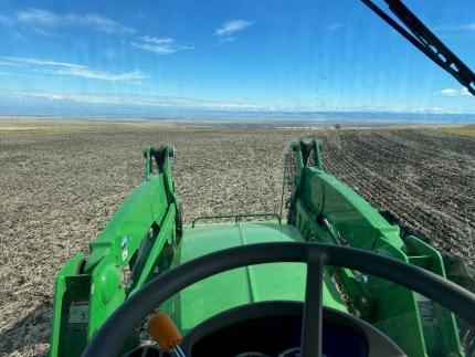 Driving tractor and seeding food plots. 