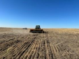 A tractor driving over a field