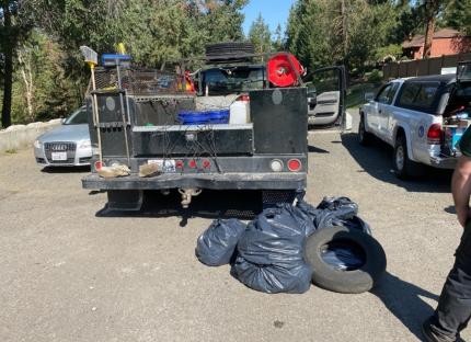 Several trash bags near a utility truck