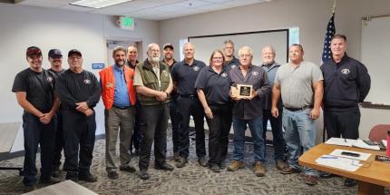 WDFW employees/volunteers present a plaque to the Walla Wall County Fire District #4 commissioners and fire fighters