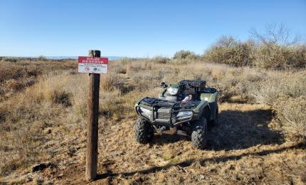 Checking signage on reserve boundary. 