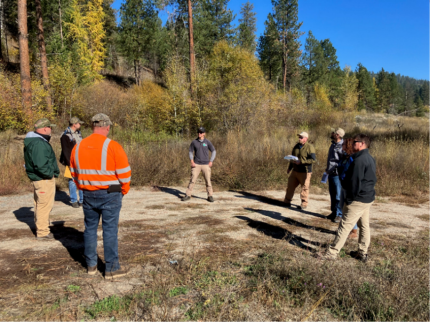 6 people meeting together at the Trout Lake site.