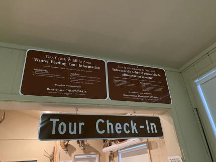 Two signs at the Oak Creek Visitor Center