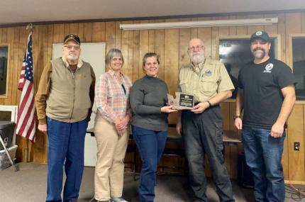 WDFW presents a plaque of appreciation. 