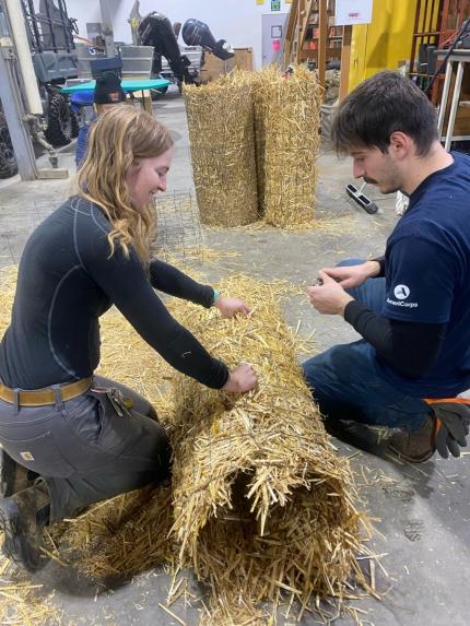 Securing a freshly made nest tube with hog rings.