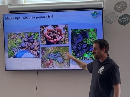 Biologist Brinkman teaching fifth grade students. 