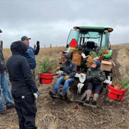 Private Lands Staff being trained to use Tree Planter.