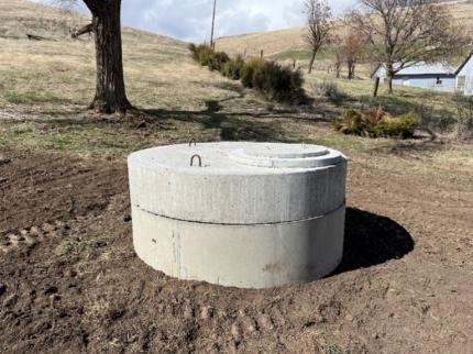 New concrete riser ring and new concrete lid installed by Meisner and Hammons.