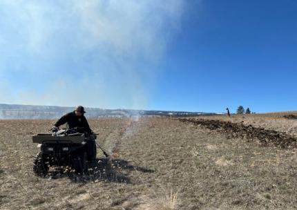 Natural Resource Technician Hammons starting an extra layer of fire line protection. 