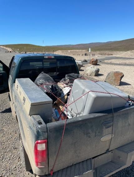 Pick-up truck load with target shooting trash. 