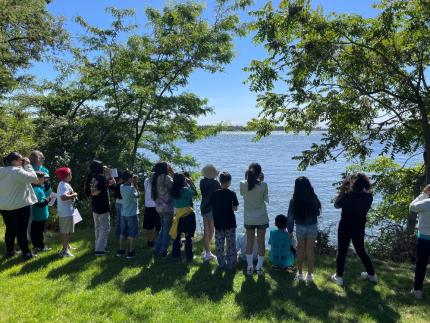 An elementary class at Sacagawea Park viewing American White Pelicans.