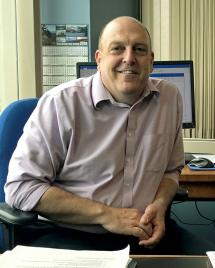 WDFW Director Kelly Susewind seated at his desk