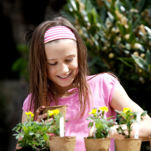 Girl prepares plants for garden